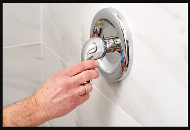 How do you remove a stubborn shower handle?